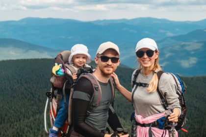 A family with a baby in the mountains