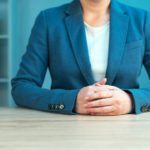 Business negotiation skills with female executive at office desk